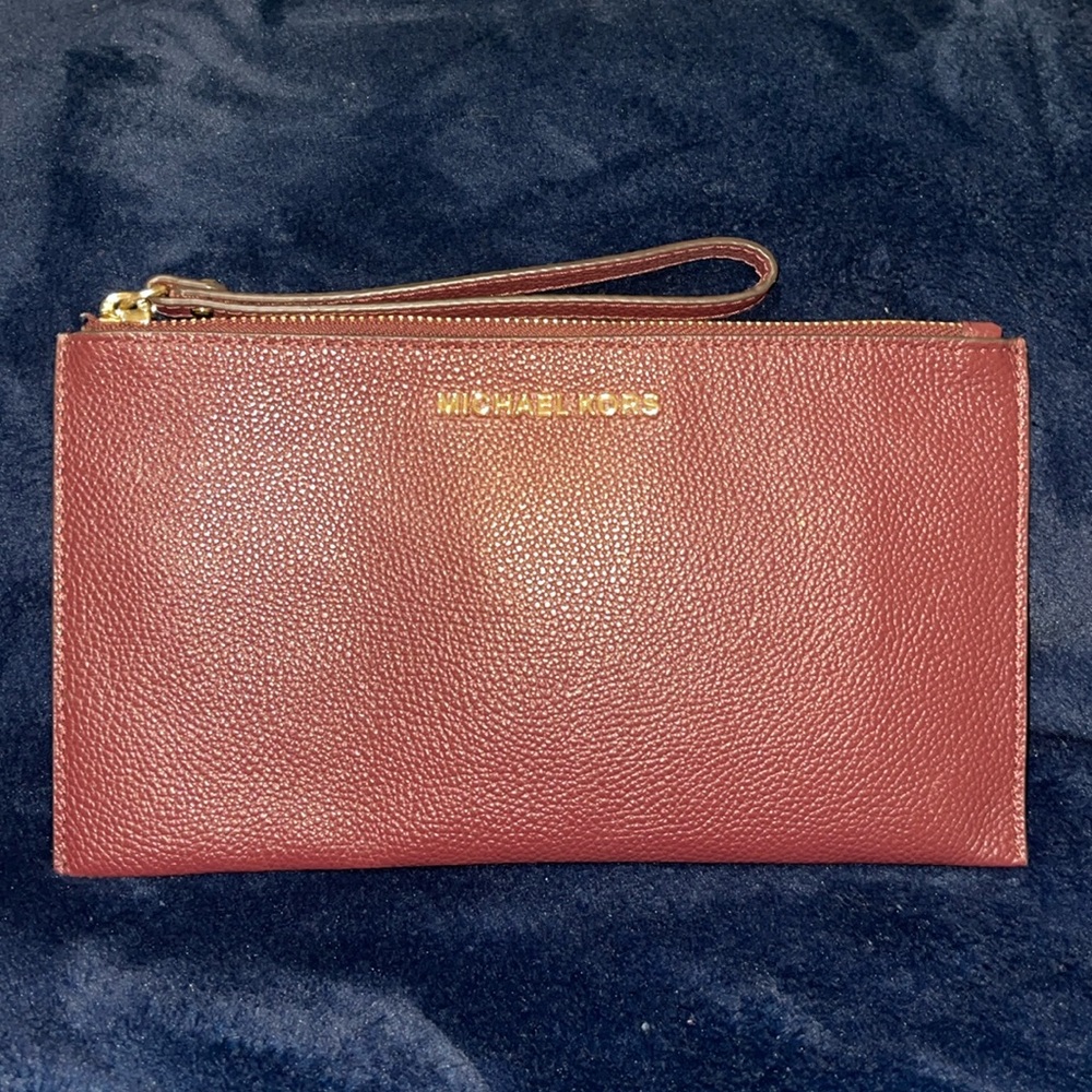- Authentic Michael Kors wristlet